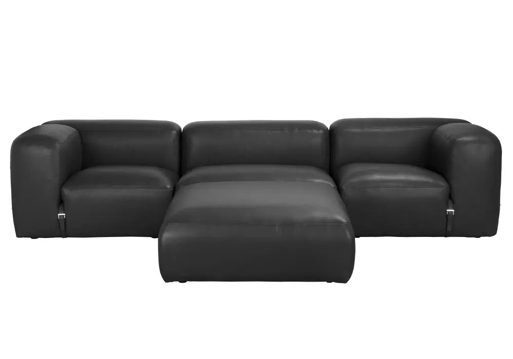 The Buckled Black Leather Modular Sofa is a contemporary sectional with rounded arms and a spacious central ottoman, made of individual pieces, shown from the front on a white background.
