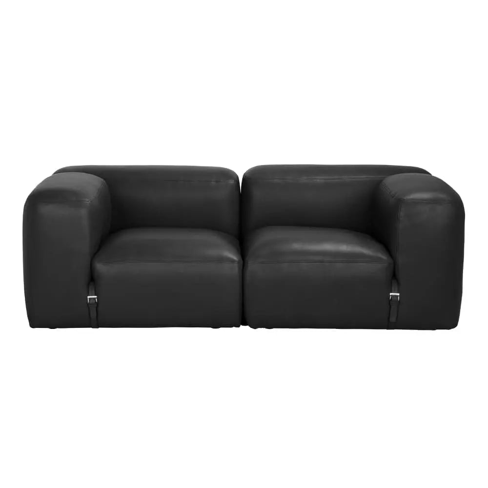 The Modular Black Leather Belted Sofa features wide, rounded armrests and metal legs, shown from the front on a white background. Available in multiple configurations to fit your space.