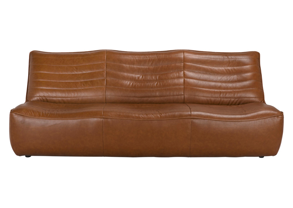 The McCLAIN 3 SEATER in Roche Tan Leather is a modern sofa with a low backrest, horizontal stitching, and a curved, minimalist design for a smooth, seamless look.