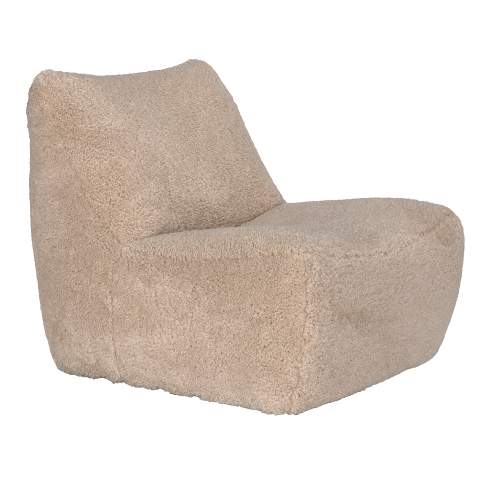 The McCain Swivel Chair in camel fabric offers a modern touch with its soft, textured upholstery, low blocky silhouette, and angled backrest for stylish comfort in any living room.
