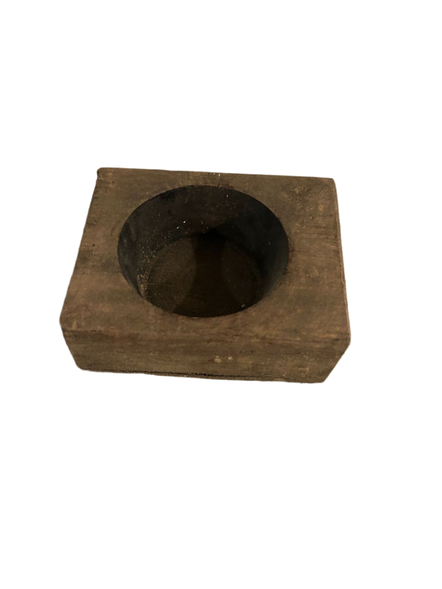 The Small Square Wood Block Dish is a carved wooden dish with a circular, shallow indentation in the center, shown on a white background.