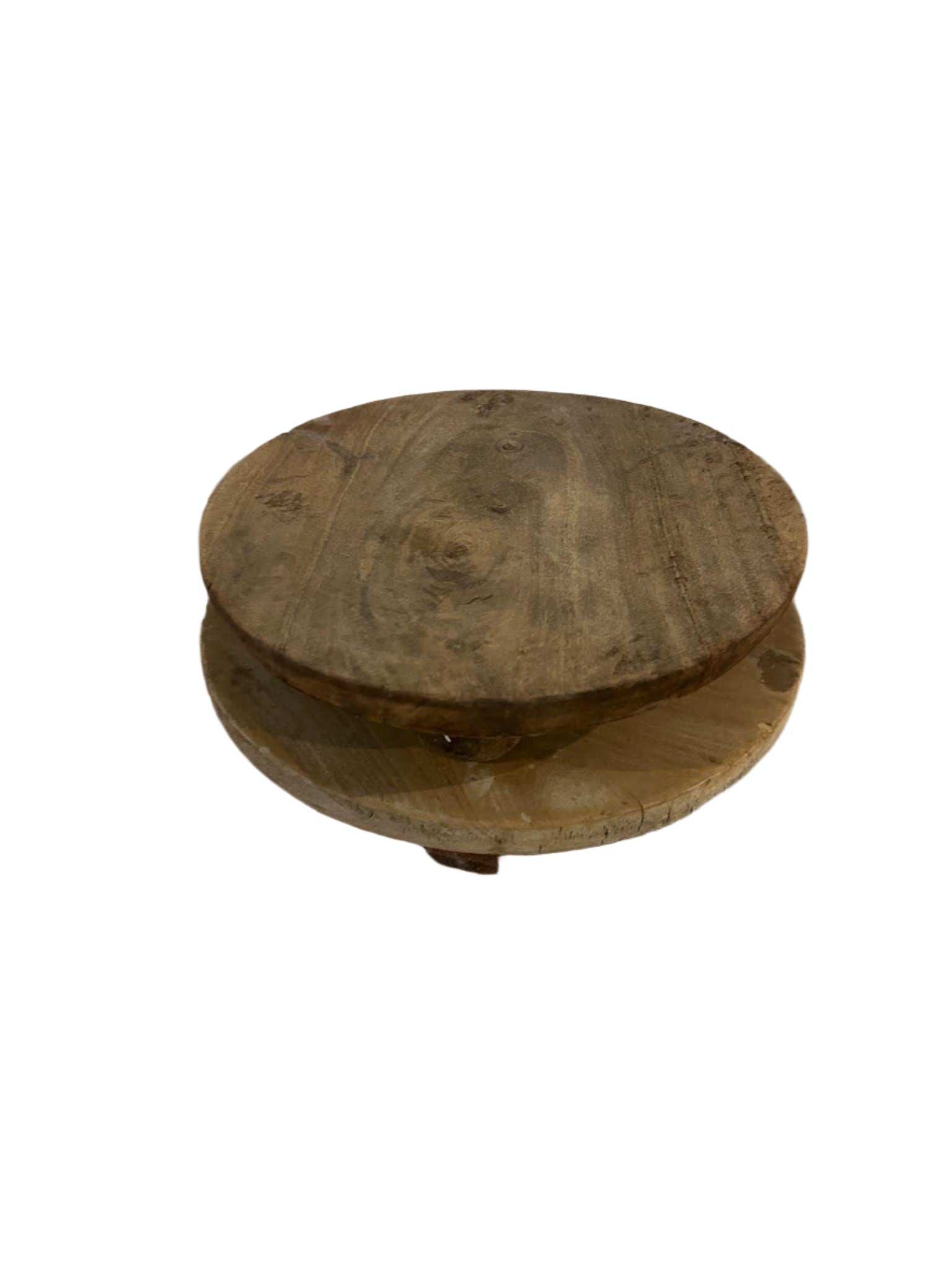 The Natural Wood Riser is a rustic, round wooden stand with a smooth surface, visible grain, and a 10-inch diameter, slightly elevated above the ground and shown on a white background.