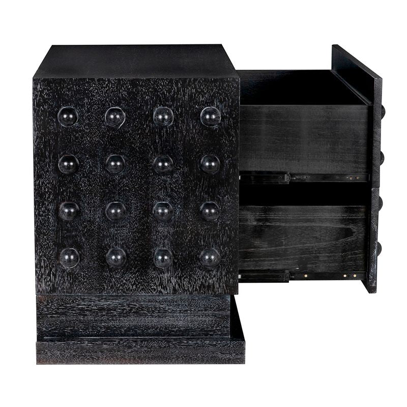 The Didier Sideboard in Black Walnut features a textured front with raised circular knobs and two partially open drawers—a premium walnut piece inspired by the original nightstand design.