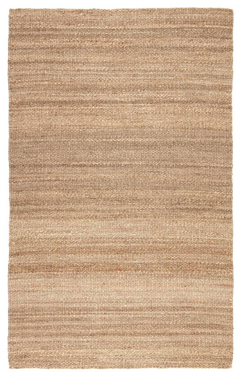 The Natural Jute Rug - 8 x 10 is a rectangular, handwoven rug in natural beige and tan, featuring a simple textured pattern with subtle horizontal color variations.