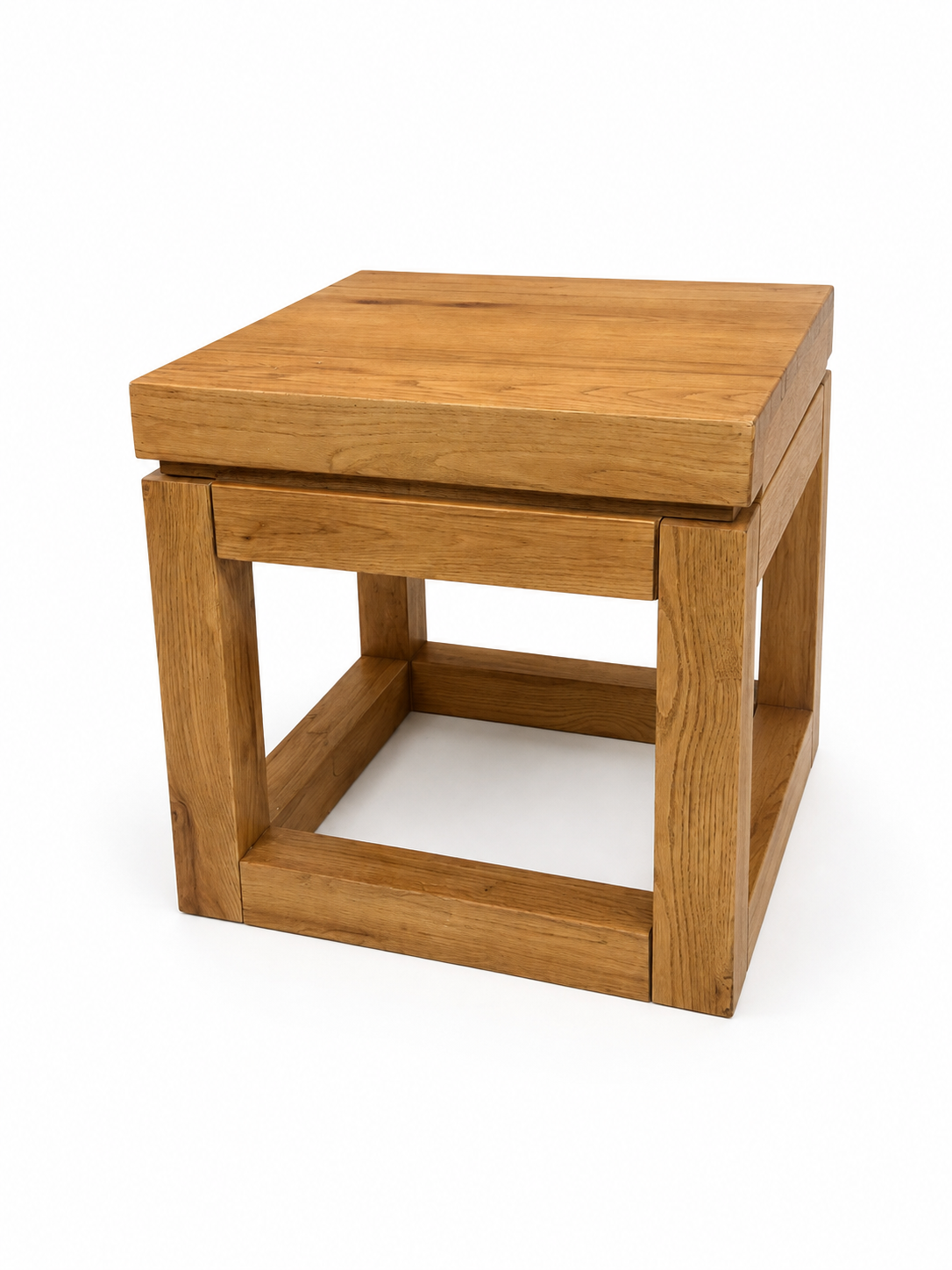 The Cube Oak End Table is a square side table with a simple, modern design. Measuring 24x24 inches, this end table features a flat top and an open, box-like frame crafted from rectangular oak pieces, making it the perfect small accent table for any living space.