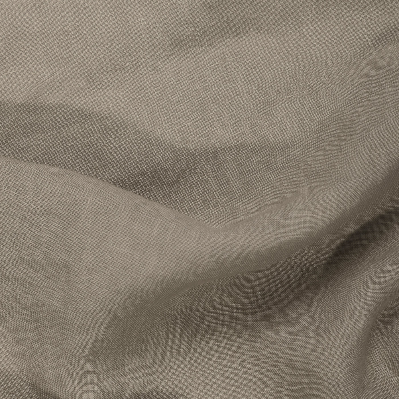 Close-up of Riviera Cotton Bath Towel in Oat, featuring visible texture and weave pattern with gentle folds—an ideal example of garment-dyed cotton towels crafted using non-toxic dyes.