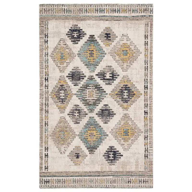 The Bohemian Vintage Rug is a rectangular cream area rug with a geometric diamond pattern in muted teal, yellow, gray, and black and detailed borders. Available in custom sizes or standard 7'6" x 9'6".