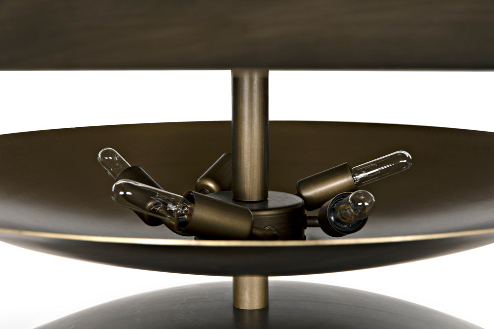 A close-up highlights the intricate details and warm glow of the Chandelier Two Tiered Metal with Aged Brass Finish, showcasing its artisan craftsmanship and unique design.