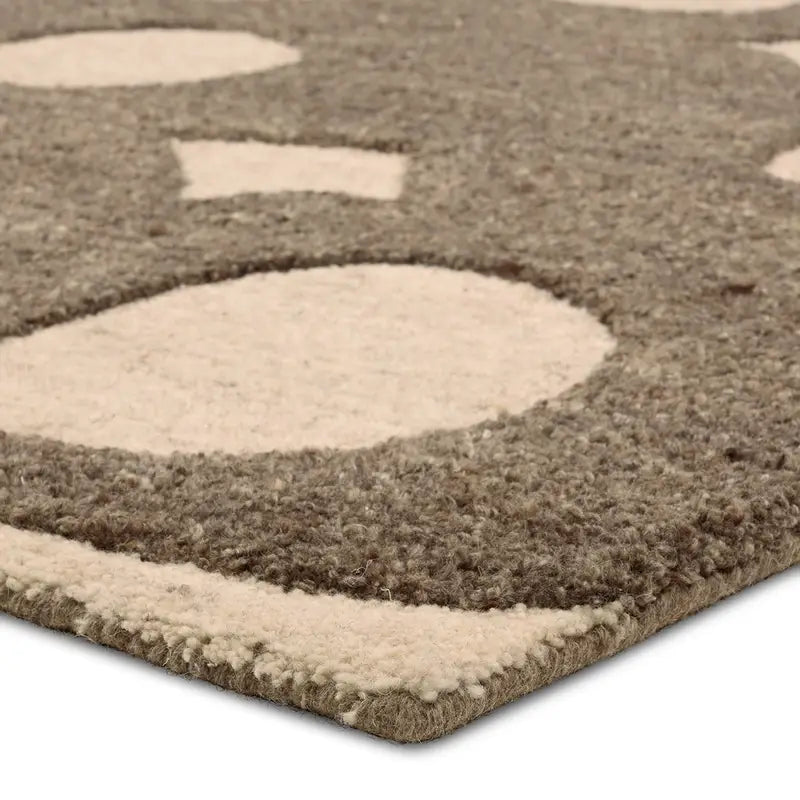 Close-up of the Retro Wool Hi-Lo Rug 9'6"X13'6", featuring a plush pile, brown background, and large, irregular cream shapes for a soft, textured look.
