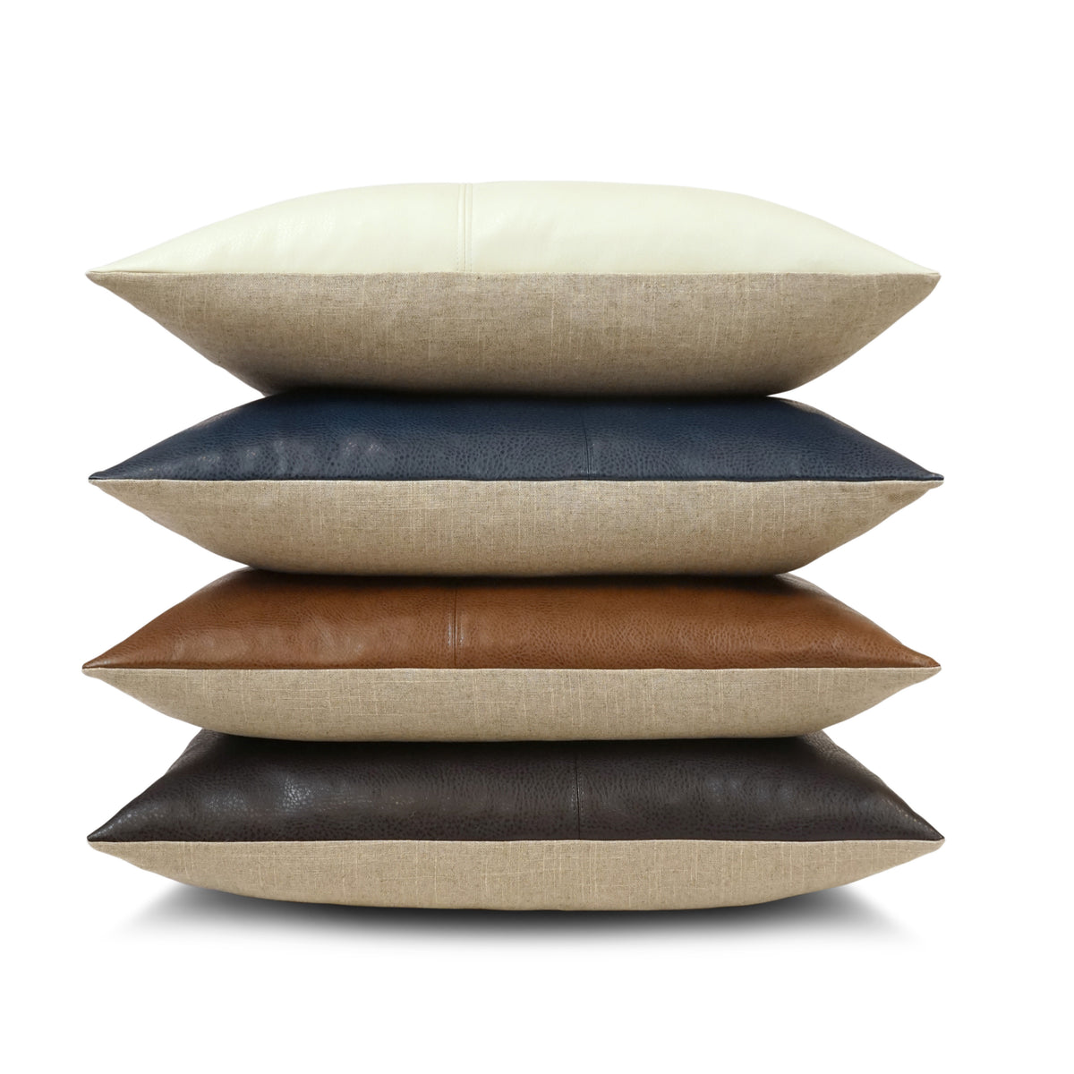 A set of four Wrangler Pillows in cream, navy blue, brown, and dark brown hues is neatly stacked against a white background, with each pillow featuring textured beige polyester fabric along the sides.