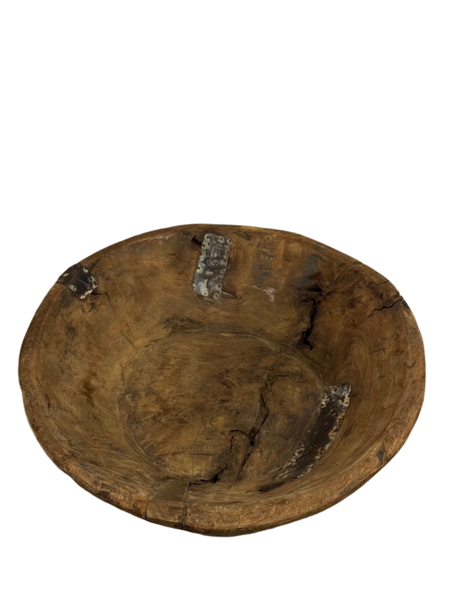 The Natural Wood & Metal Trim Platter is a rustic 17-inch round tray with visible cracks, dark metal patches, and a weathered finish—its rough, uneven surface makes it a unique decorative accent for your home.