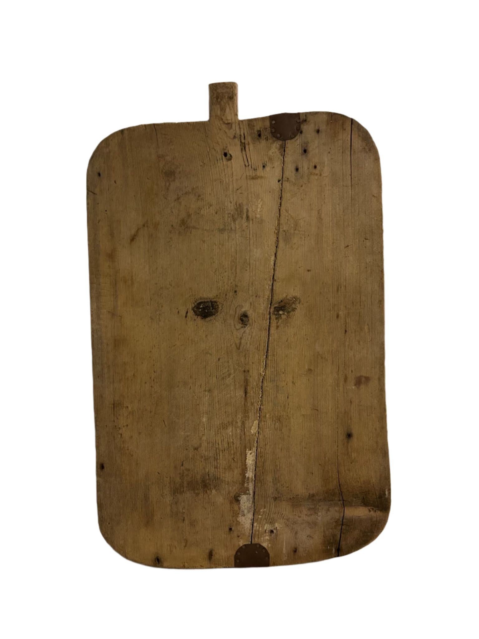 The Rounded Edge Cutting Board features a rectangular, weathered wood design with rounded corners and a small top handle. Visible cracks and dark stains add character, making it ideal to display on a 19.5-inch wide desk against a white background.