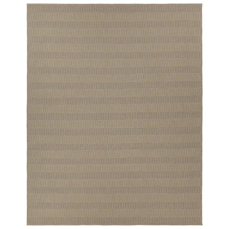 The Handwoven Beige Rug features a simple, modern look with thin light beige lines on a taupe background. Available in 6'x7' or custom sizes to suit your space.