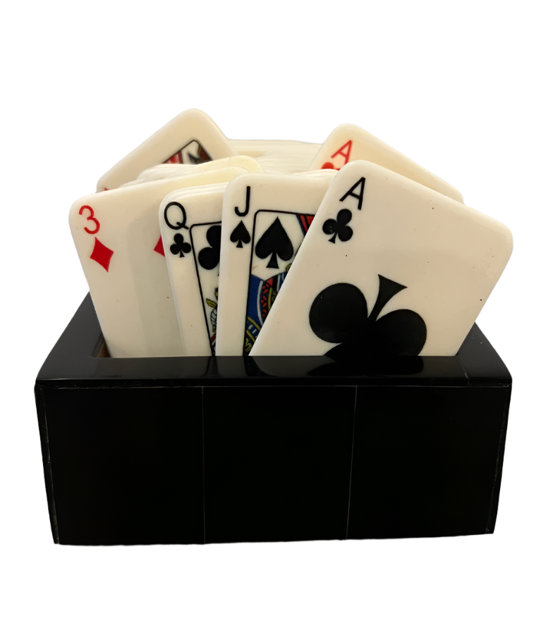 A horn box holds Bone Playing Cards, including the ace of clubs, jack and queen of spades, ace of hearts, and three of diamonds, slightly fanned out.