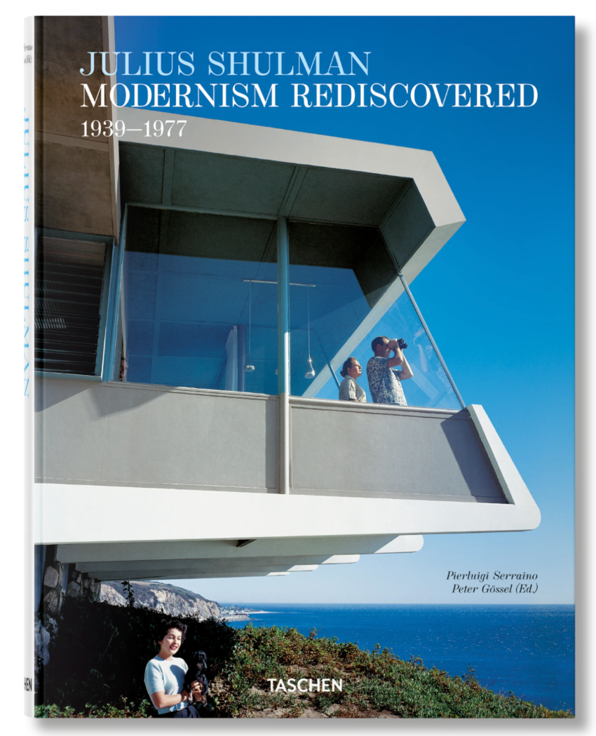 Book cover of Shulman, Modernism Rediscovered, featuring iconic photography of people on a modernist balcony with glass windows, capturing California Modernism above a coastal landscape and blue sky.