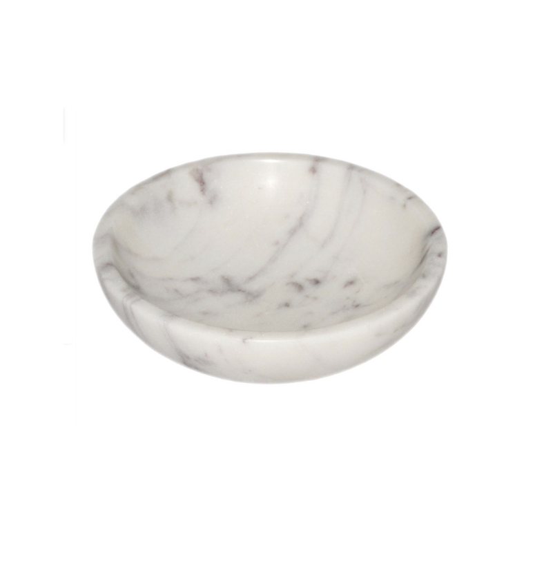 The Carrara Marble Key Bowl is a small, round, shallow decorative bowl crafted from white marble with subtle gray veining, showcasing timeless European elegance against a plain white background.