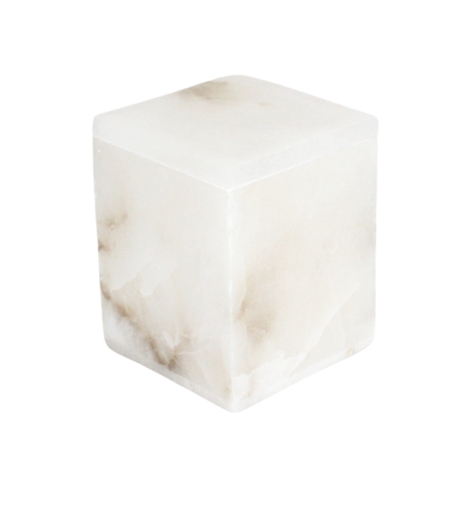 The Alabaster Square Canister is a white marble cube with soft gray and beige veining, ideal for stylish storage and organization.