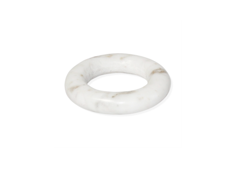 The Small White Marble Trivet features a round, thick white marble disc with subtle gray veining, displayed on a plain white background—an elegant touch of marble decor.
