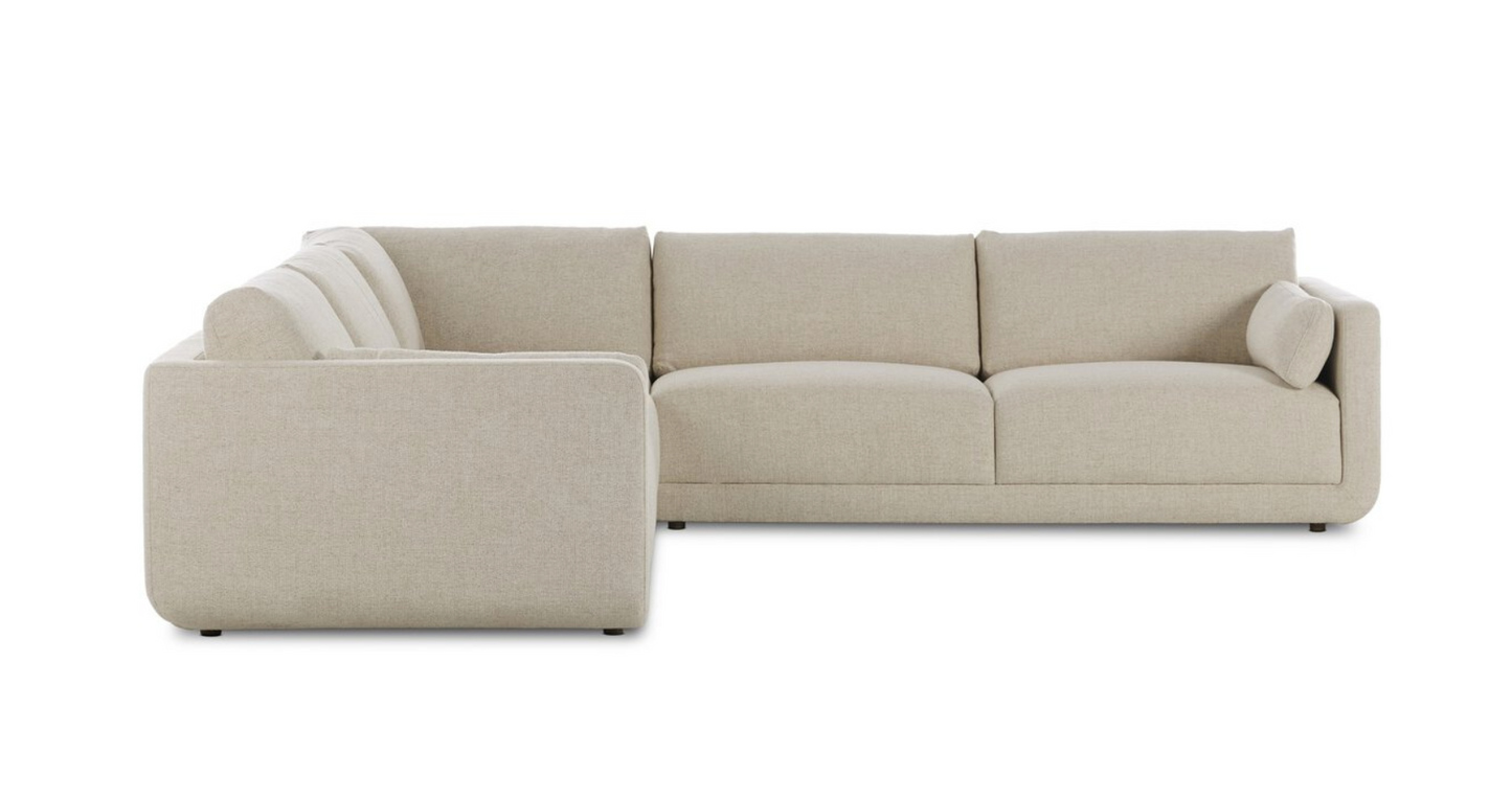 The Modular 3-Piece Sectional is a modern upholstered sofa in light beige cream basketweave fabric, featuring clean lines, three seat cushions, and a matching bolster pillow on the right armrest, shown from the front and left side.