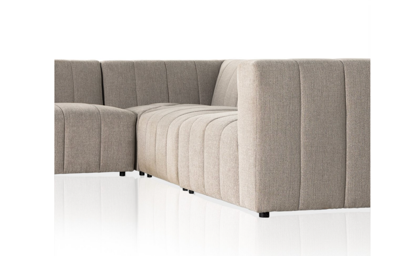 The Langham Channeled 5-Piece Sectional, upholstered in light grey performance fabric with vertical tufting and low square arms, is displayed against a white background with a reflective floor.
