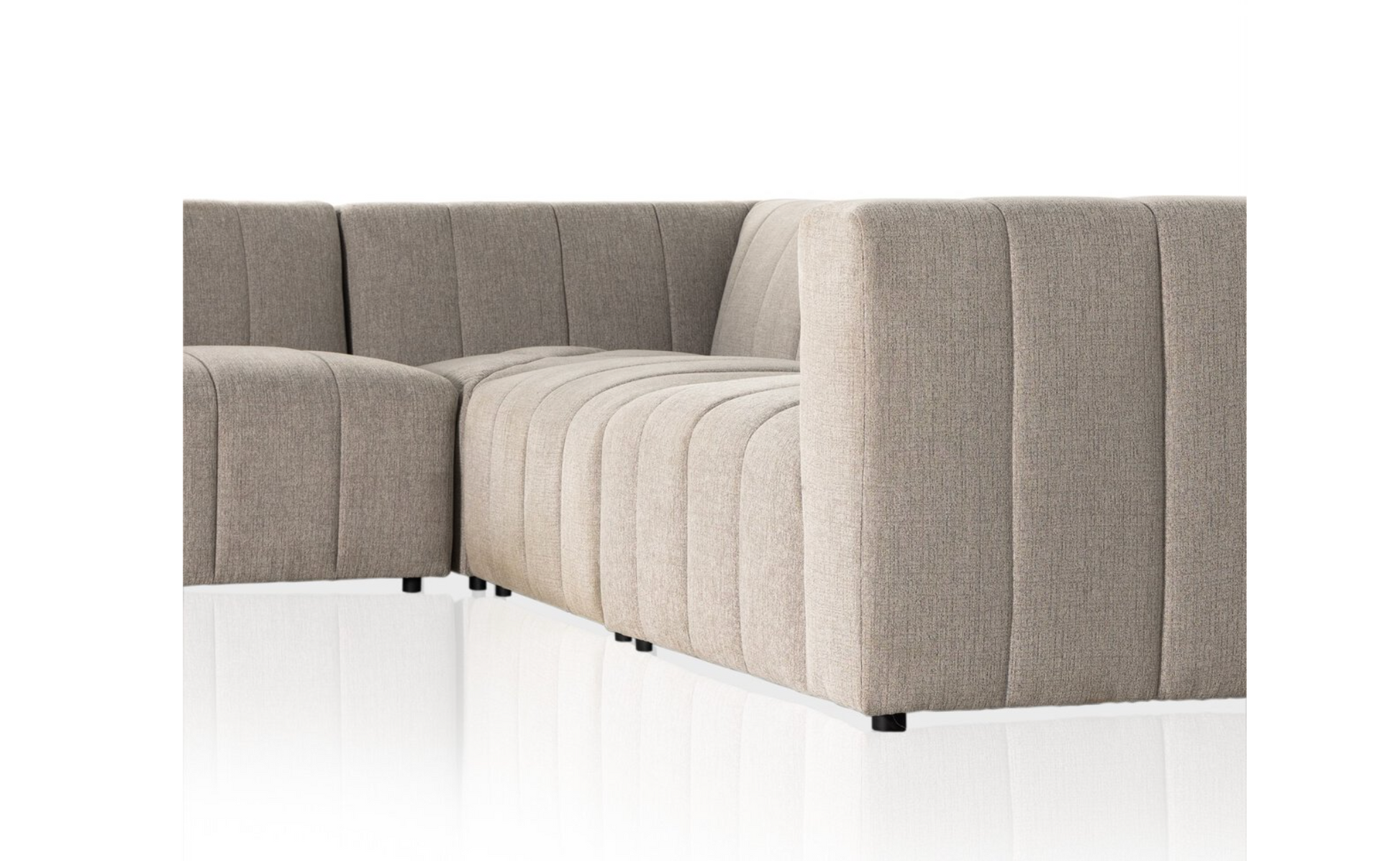 The Langham Channeled 5-Piece Sectional, upholstered in light grey performance fabric with vertical tufting and low square arms, is displayed against a white background with a reflective floor.