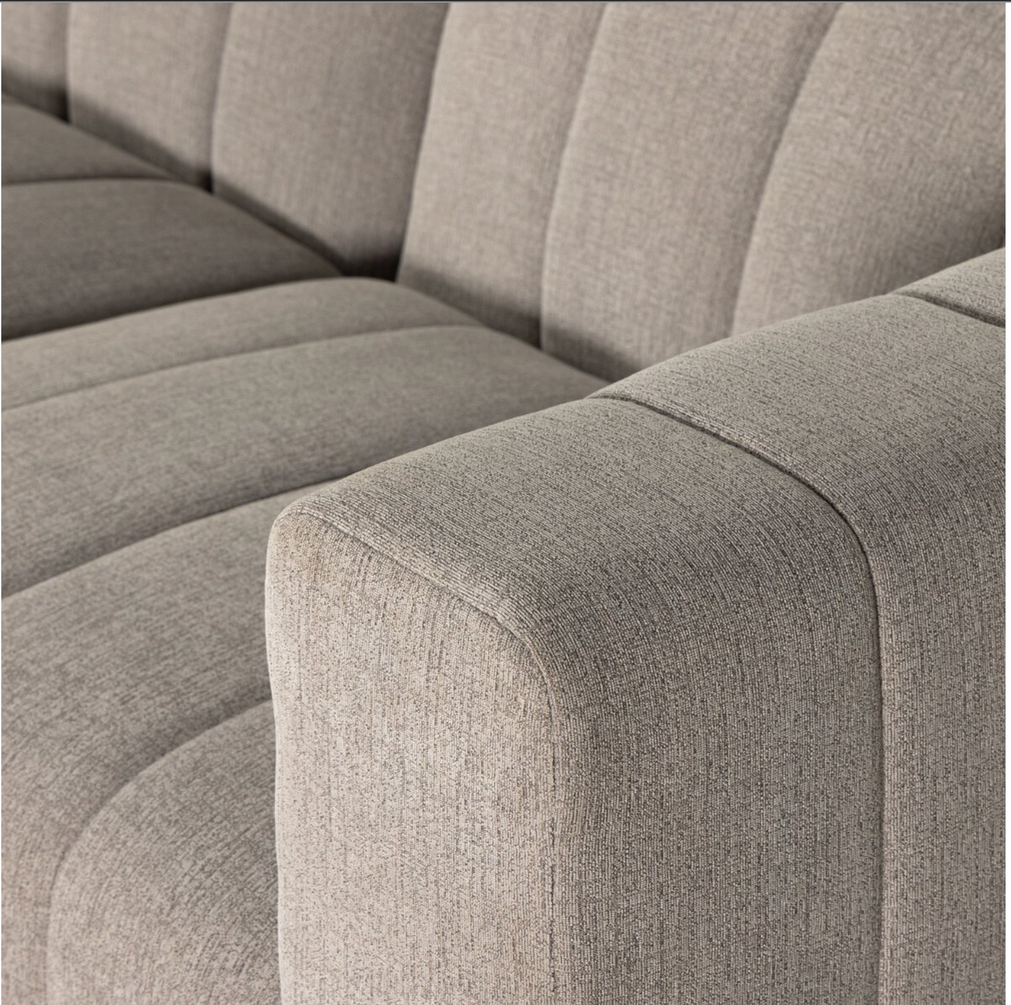 Close-up of the Langham Channeled 5-Piece Sectional in light grey, showcasing vertical stitched lines on seat and backrest. Textured performance fabric enhances its minimalist design.