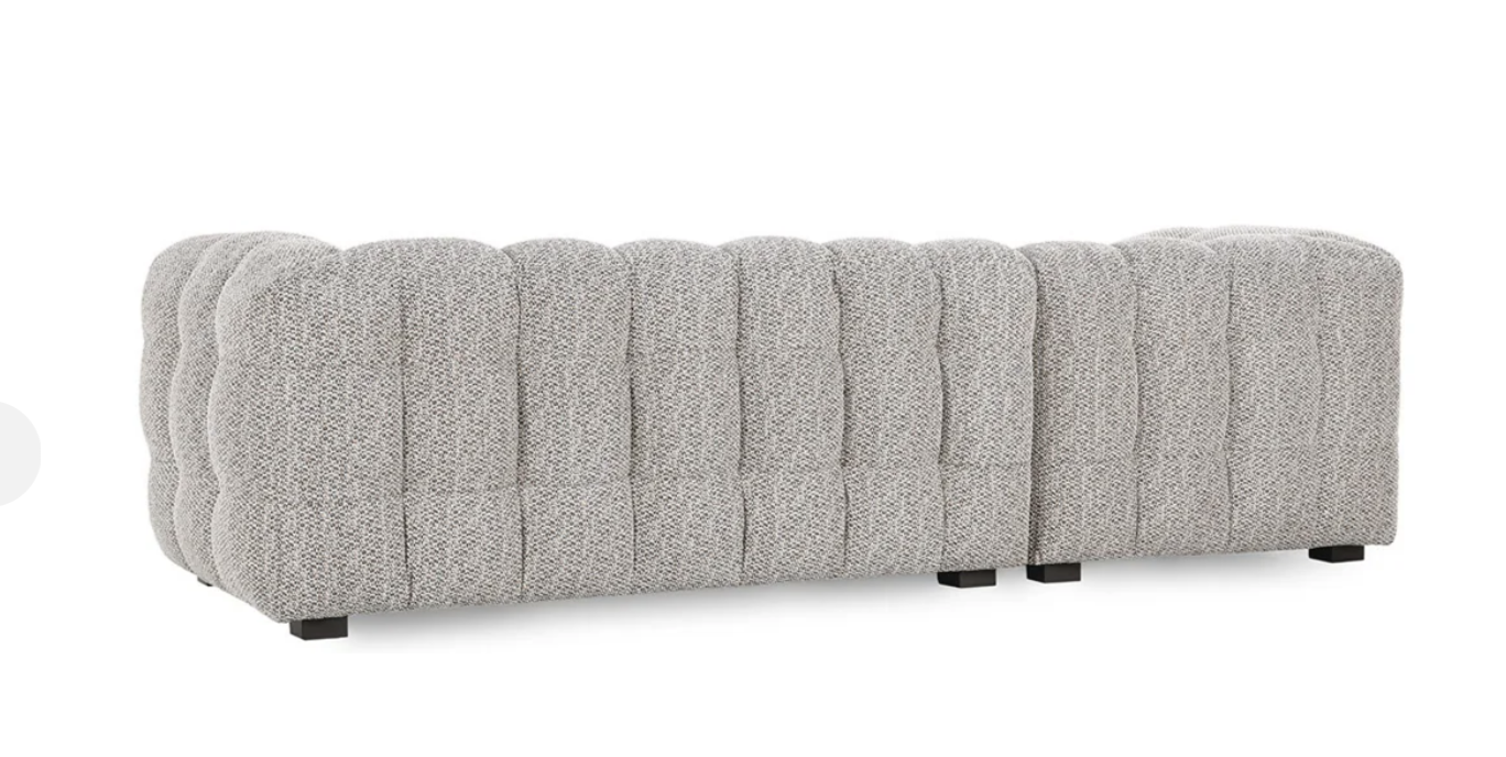 A modern heathered gray tufted Plush Upholstered Sectional w/LAF Chaise, shown from the back and side, features textured fabric, deep cushions, and short black legs—ideal for versatile comfort in any space.