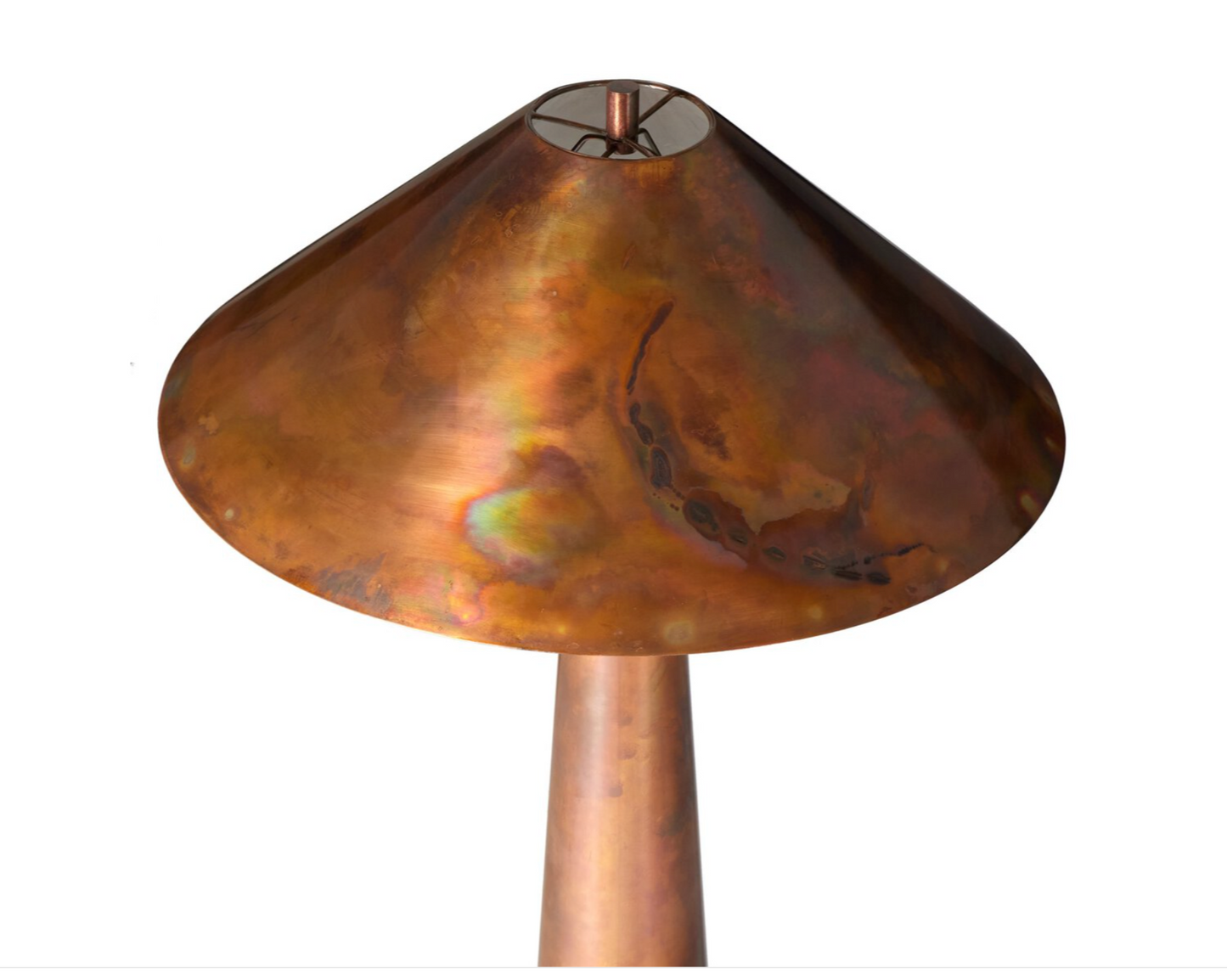 A close-up of the Romani Floor Lamp features a wide, conical copper shade with natural patina and colorful tarnish. Its gleaming copper stem stands out against a plain white background.