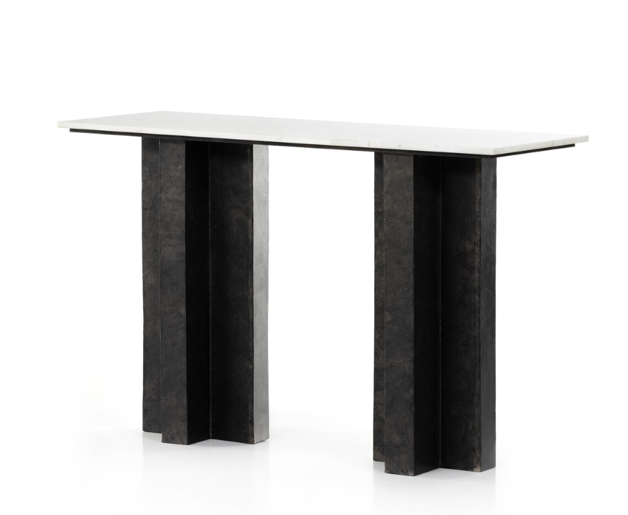 The Marble Raw Black Console Table features a slim rectangular tabletop and four wide black cast aluminum legs, displayed against a white background.