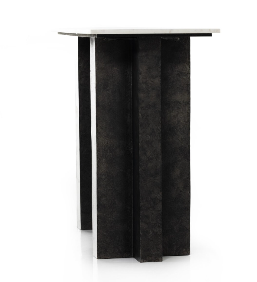 The Marble Raw Black Console Table features a solid marble tabletop and a geometric black metal base with four wide, cast aluminum legs intersecting at the center.