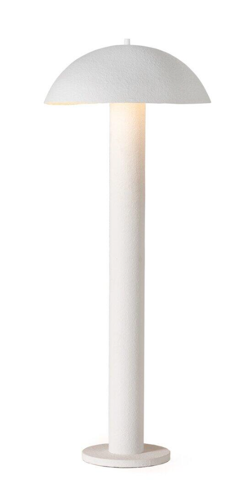 The Plaster Floor Lamp features a mushroom-shaped dome shade, a tall cylindrical base, and a circular flat bottom, casting a soft, warm glow.
