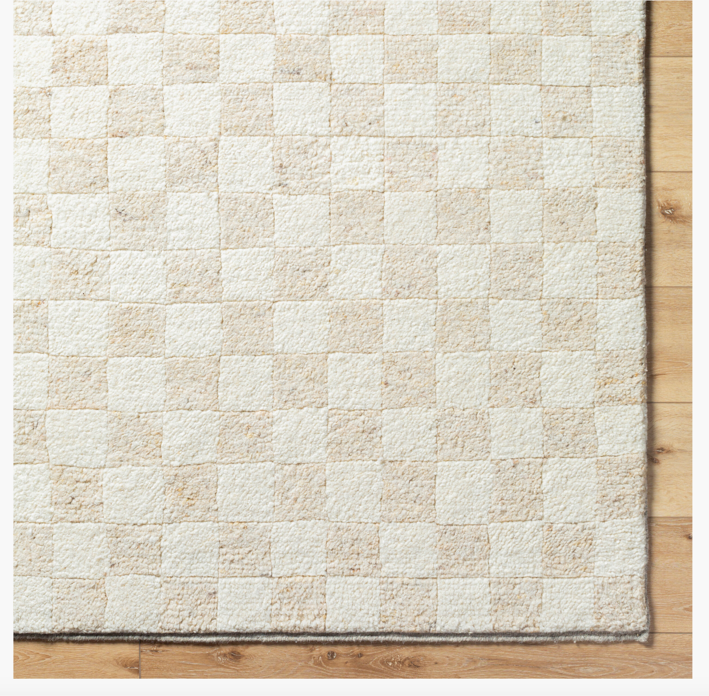 The Mono Check Rug Wool Rug 8x10 is a hand-knotted rug featuring a white and brown checkered pattern.