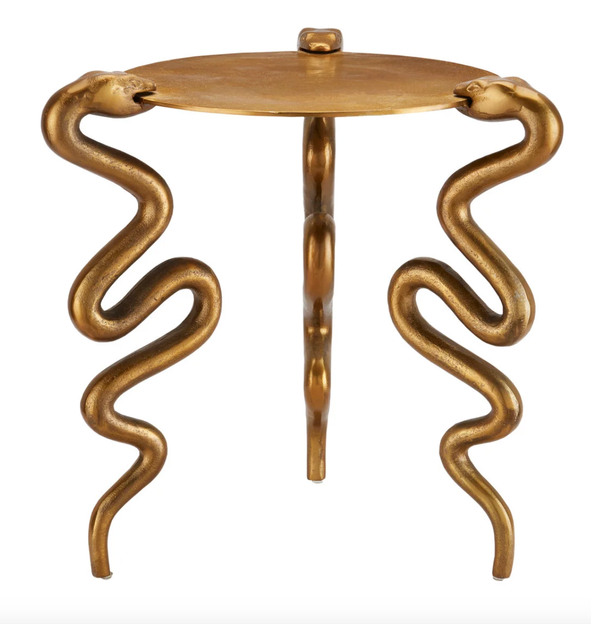 The Brass Snake Accent Table is a small, round cast aluminum table in an antique brass finish with three coiled snake-shaped legs, each topped by a sculpted snake head that connects to the tabletop.