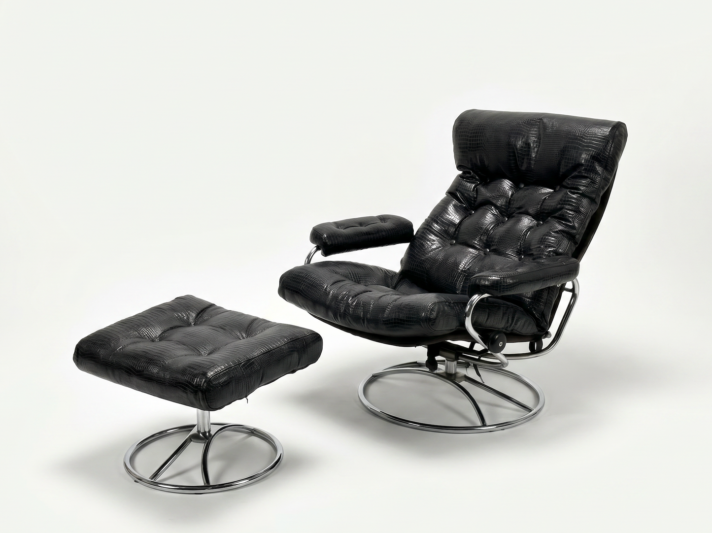 The Vintage Chrome and Leather Recliner & Ottoman features modern black croc leather, tufted cushions, and chrome metal bases, with both pieces displayed against a plain white background.