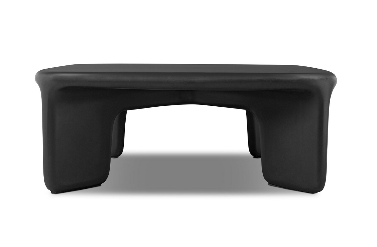 Dante Coffee Table in low-profile black with a sculpted, rounded design and thick, curved legs.