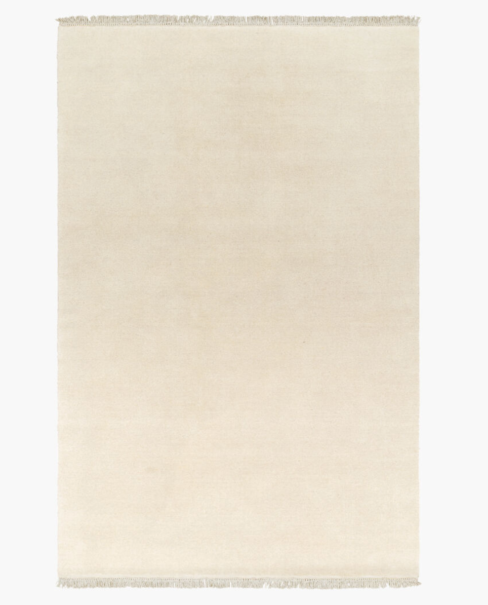 Rectangular ivory hand-knotted wool Fringe Ivory Wool Rug 9x12 with a short fringe on both ends.