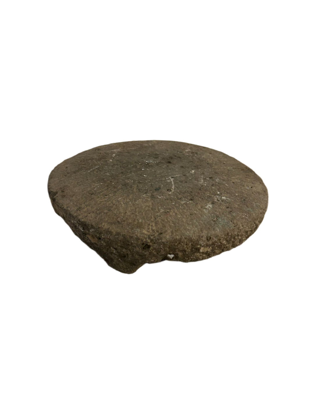 The Natural Stone Tray is a round, flat tray with a natural grey hue, rough texture, and uneven edges. Measuring 11 inches in diameter, it's shown on a white background and makes unique decor for any space.
