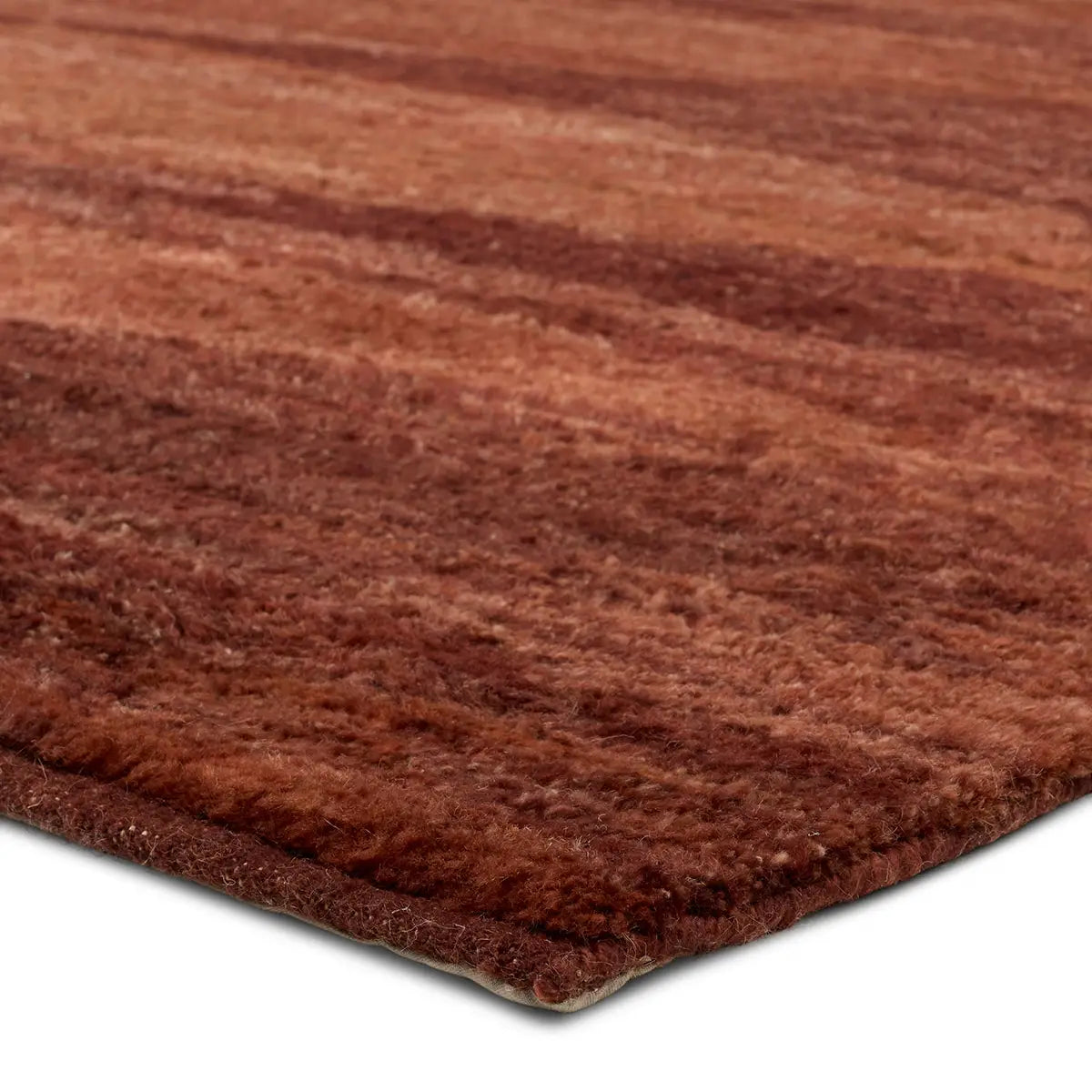 Close-up view of the corner of the 6x9 Red Monochrome Diamond Wool Rug, highlighting its soft, plush surface and rich red tones.