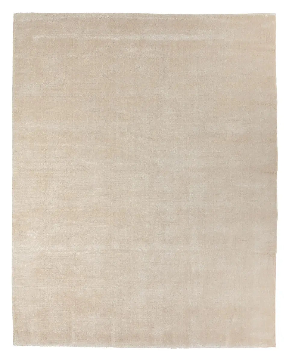 A square, beige Handwoven New Zealand Wool Rug made from premium New Zealand wool, offering a smooth, uniform texture with no visible patterns or designs—an understated 8x10 rug ideal for any modern space.