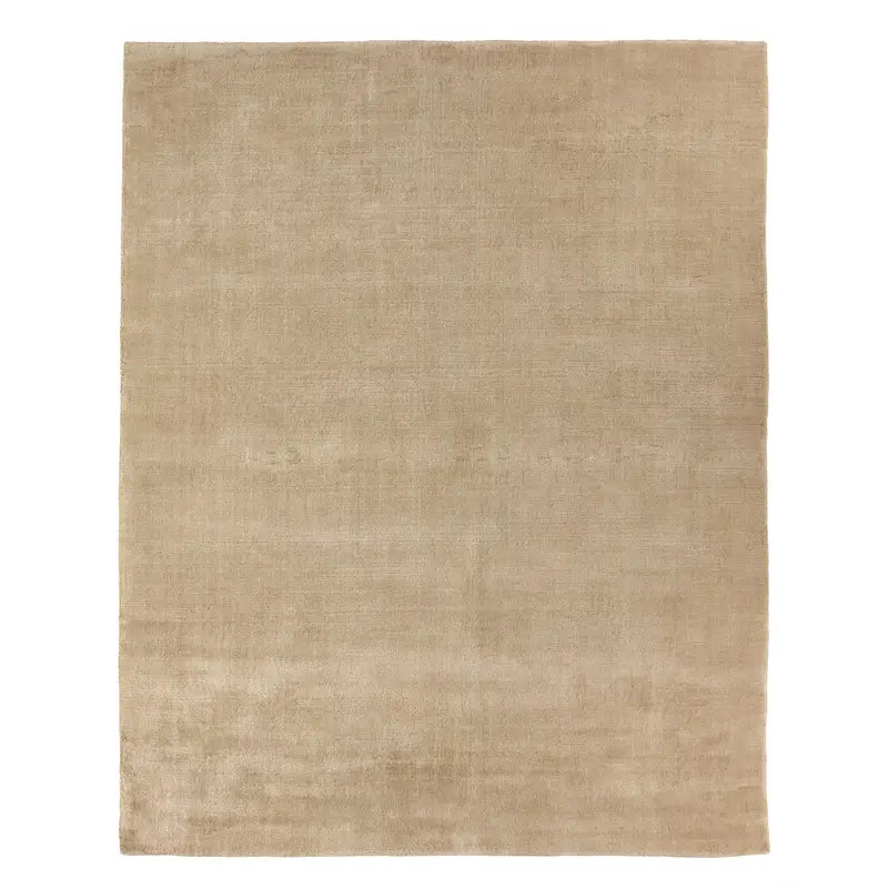 A Handwoven New Zealand Wool Rug, rectangular in shape and beige in color, measuring 8x10 feet with a plain design and no visible patterns, is displayed against a white background.