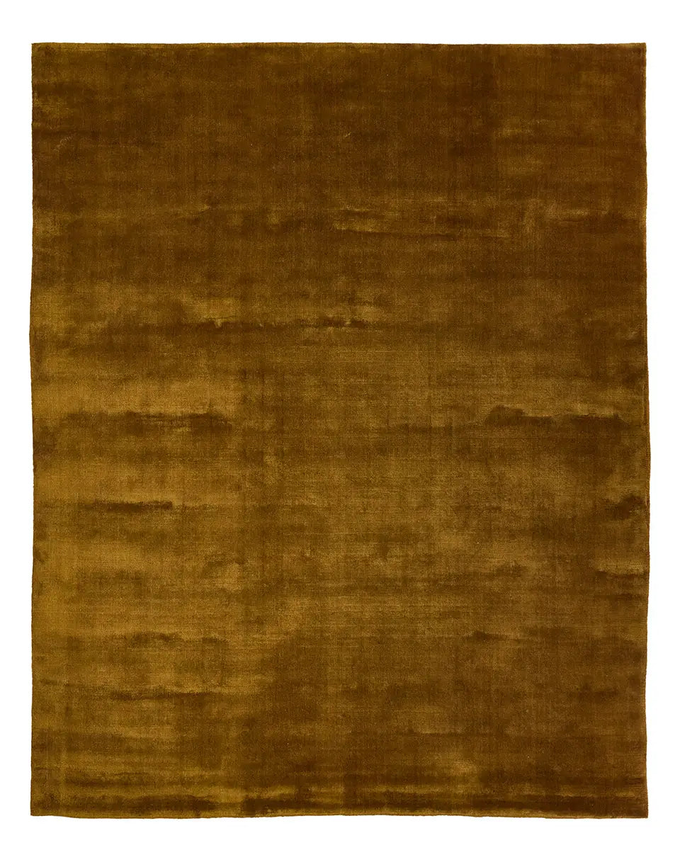 Introducing the Handwoven Golden Wool Rug, an 8x10 rectangular area rug featuring a golden-brown hue, soft plush texture, and subtle uneven shading. Expertly handwoven from premium New Zealand wool, this luxurious rug brings warmth and elegance to any space.