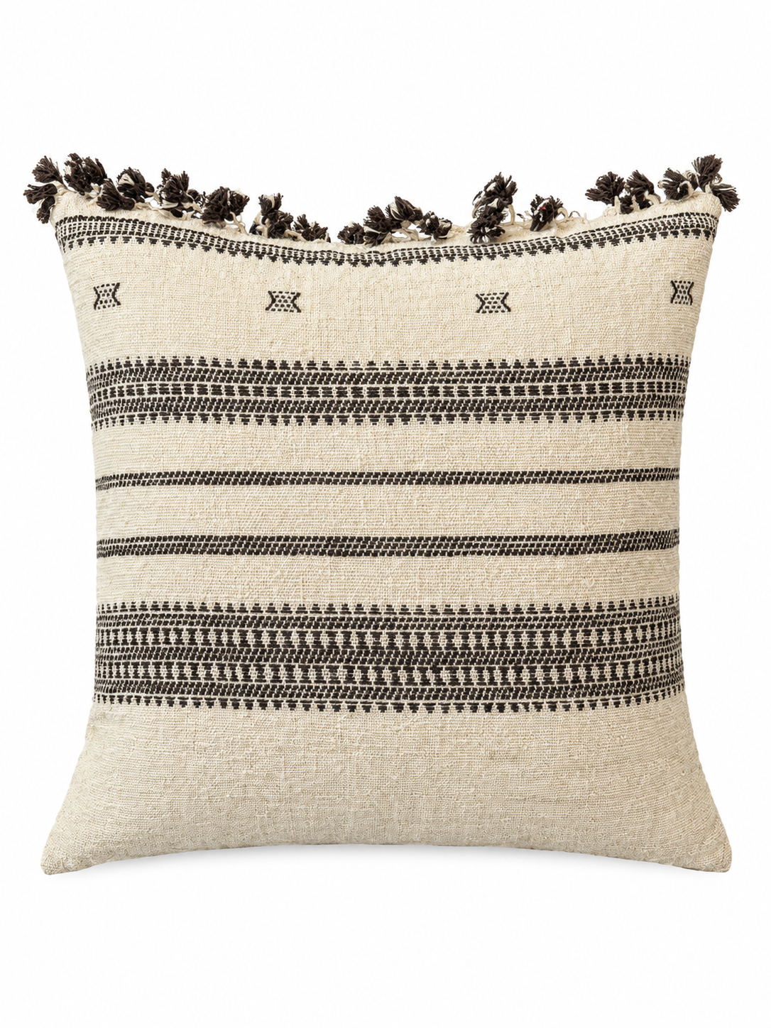 The Tasseled Indian Wool Pillow is a square beige 22 x 22 cover featuring black geometric patterns and horizontal stripes. It has black tassels along the top edge, and its woven wool texture offers a soft, cozy, and decorative look.