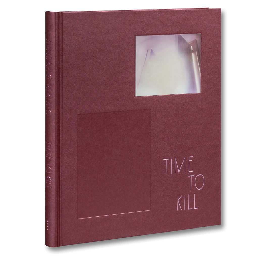 Time to Kill by Ahndraya Parlato is a maroon hardcover book featuring a rectangular window on the front cover, through which a blurred image—evoking women’s portraits—subtly explores themes of beauty ideals and gendered aging.