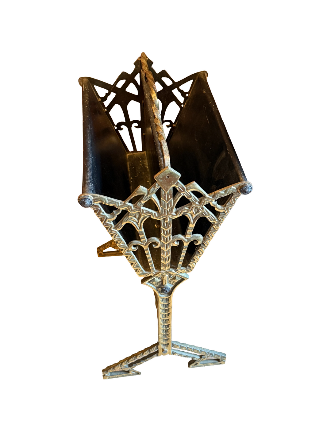 The Vintage 1920 Record Stand is a decorative metal rack with ornate geometric patterns and two compartments on a triangular base—an elegant, compact piece of furniture isolated on a white background.