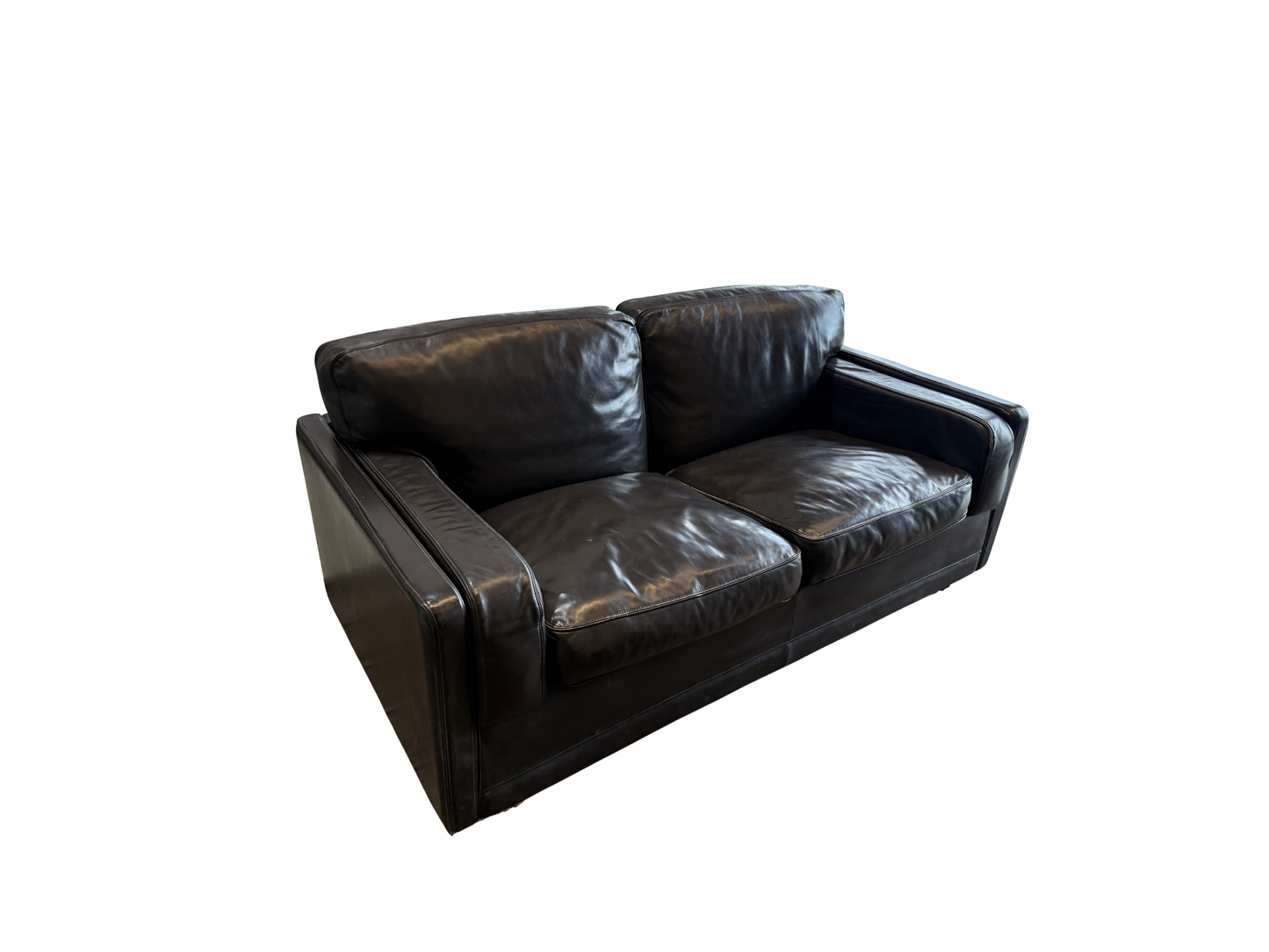 The Vintage Italian Black Leather LoveSeat with wide armrests and plush cushioned seats is shown on a white background, offering a stylish spot to relax after unwinding in your modern bathtub.