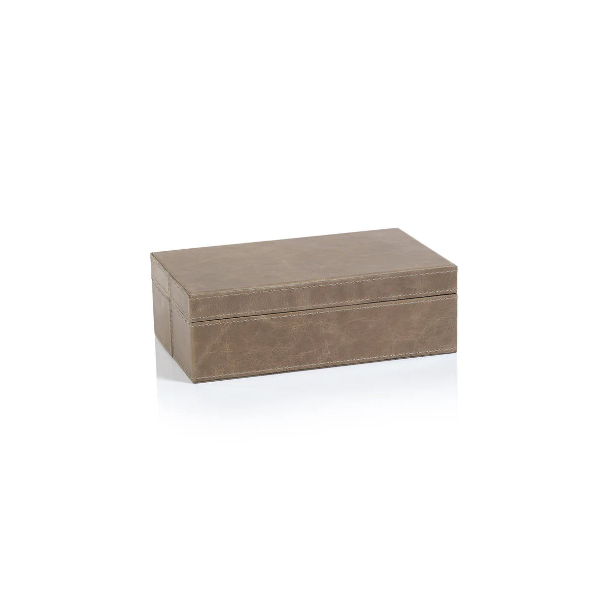 The Mink Leather Box, shown closed against a white background, is a compact and elegant small rectangular case made from brown leather with visible stitching.