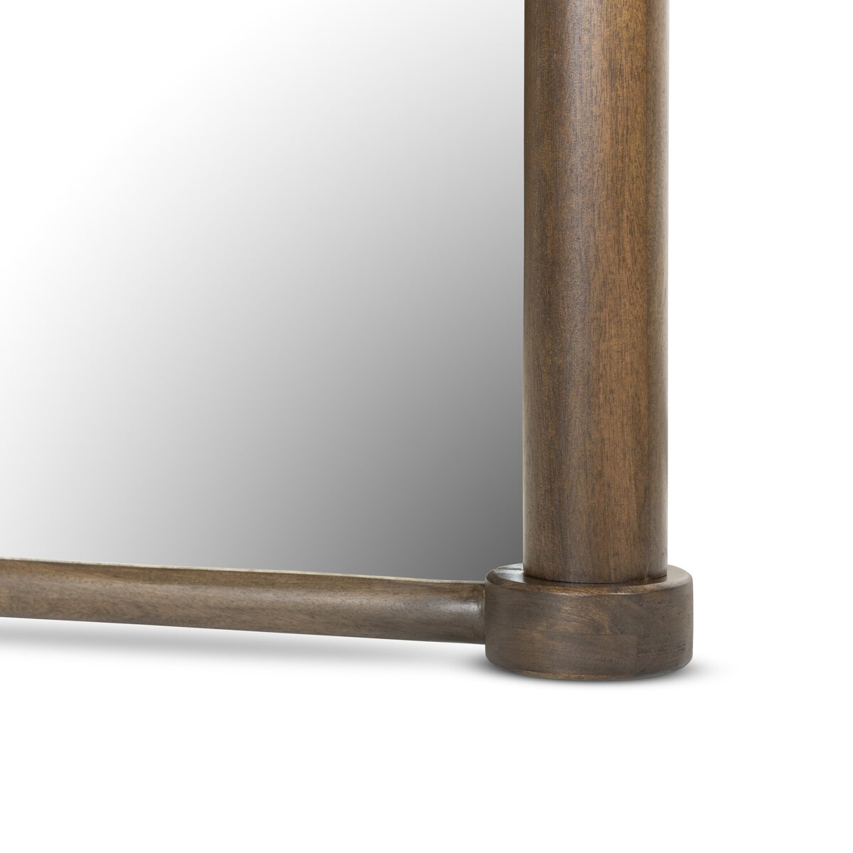 A close-up of the Decou Floor Mirror, featuring a wooden frame with a rounded upright post joined to a horizontal bar. Part of the reflective surface is visible in the background. Overall dimensions: 82.25" high.