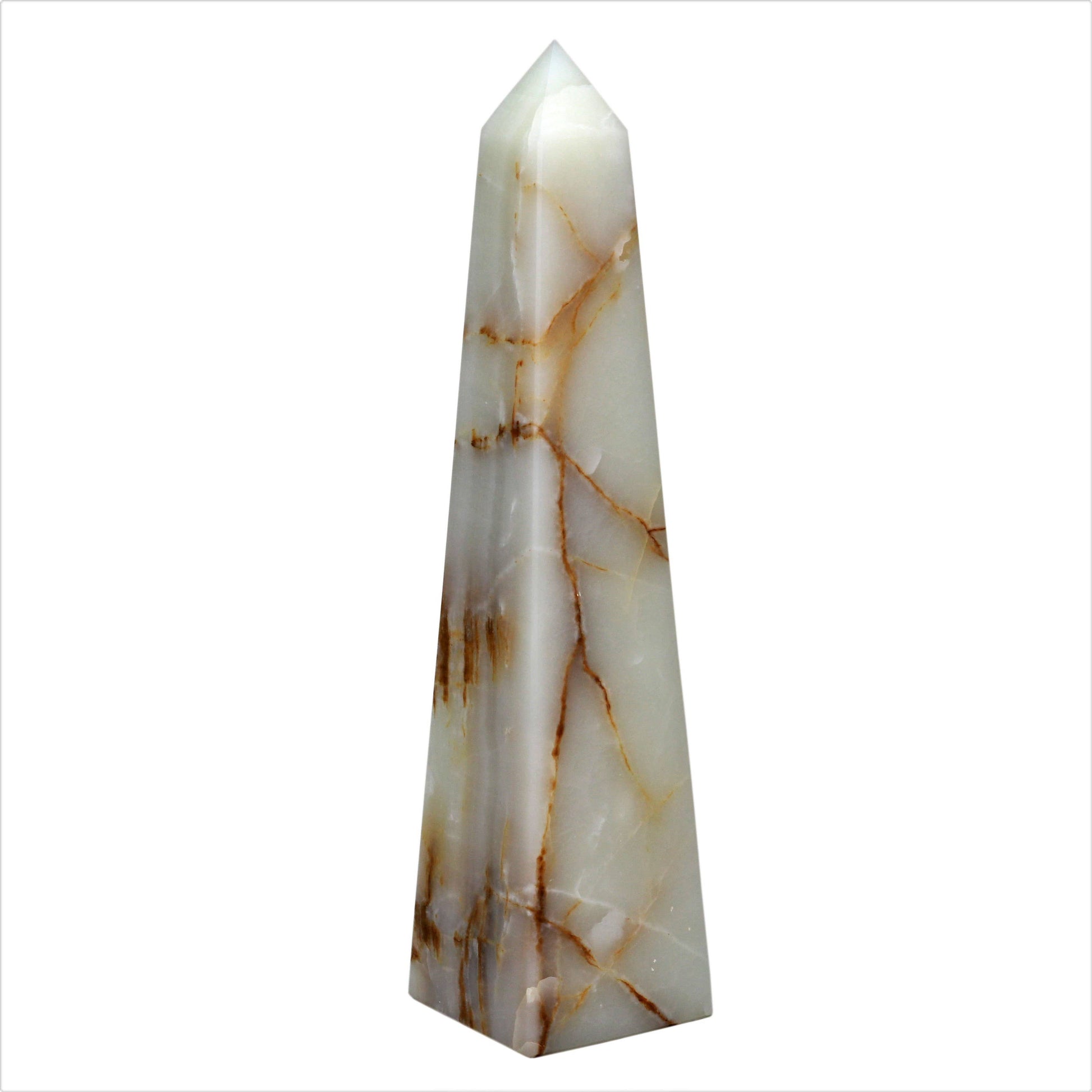 A tall, pointed Light Green Onyx Obelisk with a honed finish and smooth white stone featuring brown and gold veins stands upright against a plain white background.