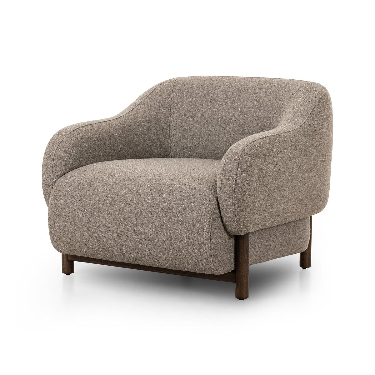 The Grey Weave Arm Chair is a modern oversized armchair with rounded edges, upholstered in textured grey fabric, and features a low wooden base and legs. Please refer to overall dimensions for exact measurements.