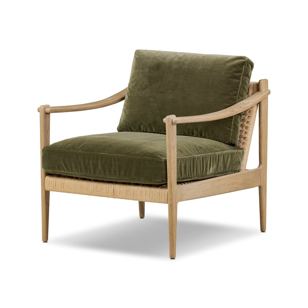The Barwin Accent Chair features a light wood frame, olive green velvet cushions, woven back detail, and angled legs. Dimensions: 29.50"w x 33.50"d x 31.75"h, shown against a white background.